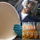 Worker in safety gear holding a barrel