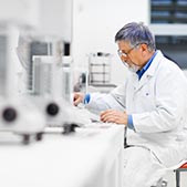 Male scientist reviewing data in lab